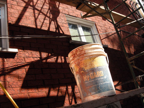 The bricks are washed with an acid solution.